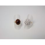Two 9ct dress rings with garnet and white stone cluster settings