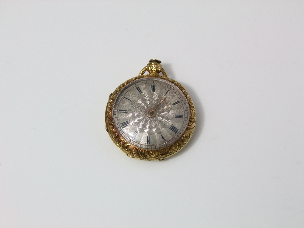 A late 19th century gold dress watch, the case with engine turned and foliated detail, the