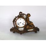 A 19th century gilded brass mantle clock with 8 day striking movement, the case with harp, floral