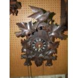 A Tyrolean cuckoo clock, the case of chalet form with applied detail (with cone shaped weight and