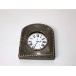 A silver night watch case with harebell border and leather back with easle stand, Chester 1906, with