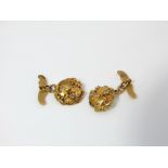 A pair of French 18 ct gold cufflinks with mythical bird detail, diamond set