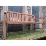 A contemporary hardwood three seat garden bench with slatted seat and back, 150 cm long approx