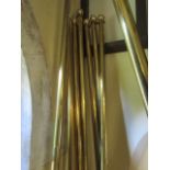 A collection of high quality polished brass curtain poles complete with rings and fittings (9 in