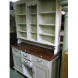 A partially painted pine kitchen dresser, the base enclosed by an arrangement of four frieze drawers