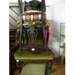 An Edwardian stained walnut drawing room/nursing chair with green dralon upholstered seat and button