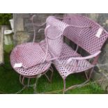 A contemporary steel framed two seat garden bench with decorative lattice work seat and back