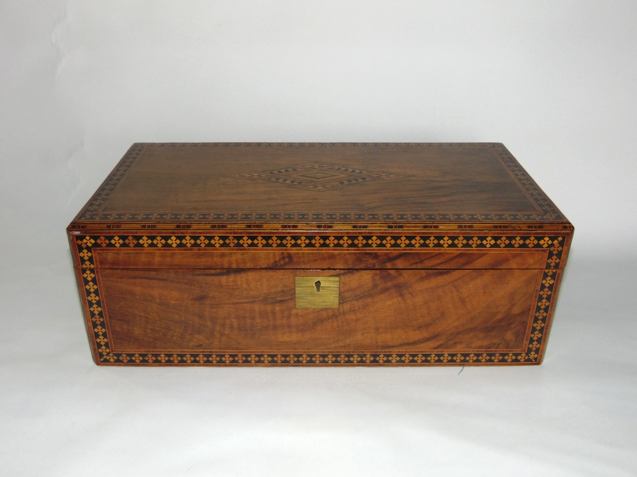 A substantial Victorian walnut and straw work marquetry laptop desk with fitted interior