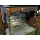 A 19th century mahogany side table fitted with two frieze drawers raised on four ring turned and