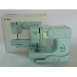 J L Mini Electric Sewing Machine, with instruction book and original packaging