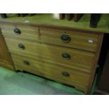 An Edwardian ashwood dressing chest of two long and two short drawers with incised line detail