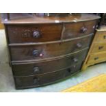 A 19th century mahogany bow fronted bedroom chest of three long and two short drawers with turned