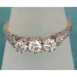 An 18ct gold and platinum three stone diamond ring, total carat weight 0.50ct approx with diamond