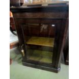 A Victorian plum pudding mahogany side cupboard enclosed by a glazed panelled door with maple