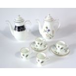 A collection of Caverswall Traditional Arts English Garden pattern coffee wares with cornflower