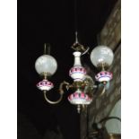 A ceramic and brass three branch ceiling light in the Victorian style with etched glass shades