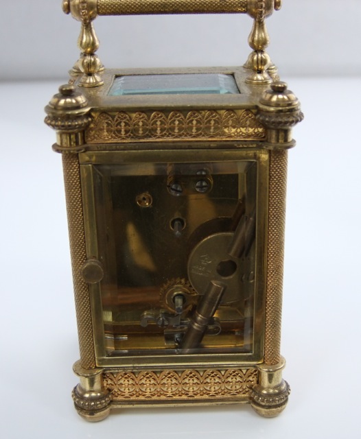 A late 19th century brass carriage clock, the casework with filigree and other detail enclosing a - Image 3 of 4