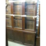 A 19th century mahogany library bookcase, the upper section enclosed by three rectangular glazed and