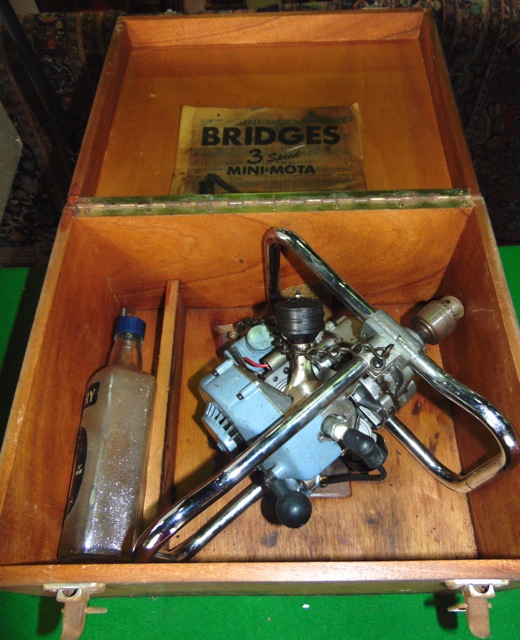 A vintage petrol driven drill by Bridges with three speed mini mota, with chrome casework and