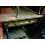 An antique oak side table with rectangular top over a frieze drawer, raised on turned bobbin