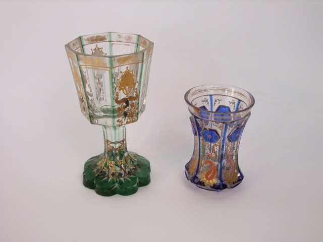 A 19th century continental glass goblet of octagonal form with alternating painted and gilded