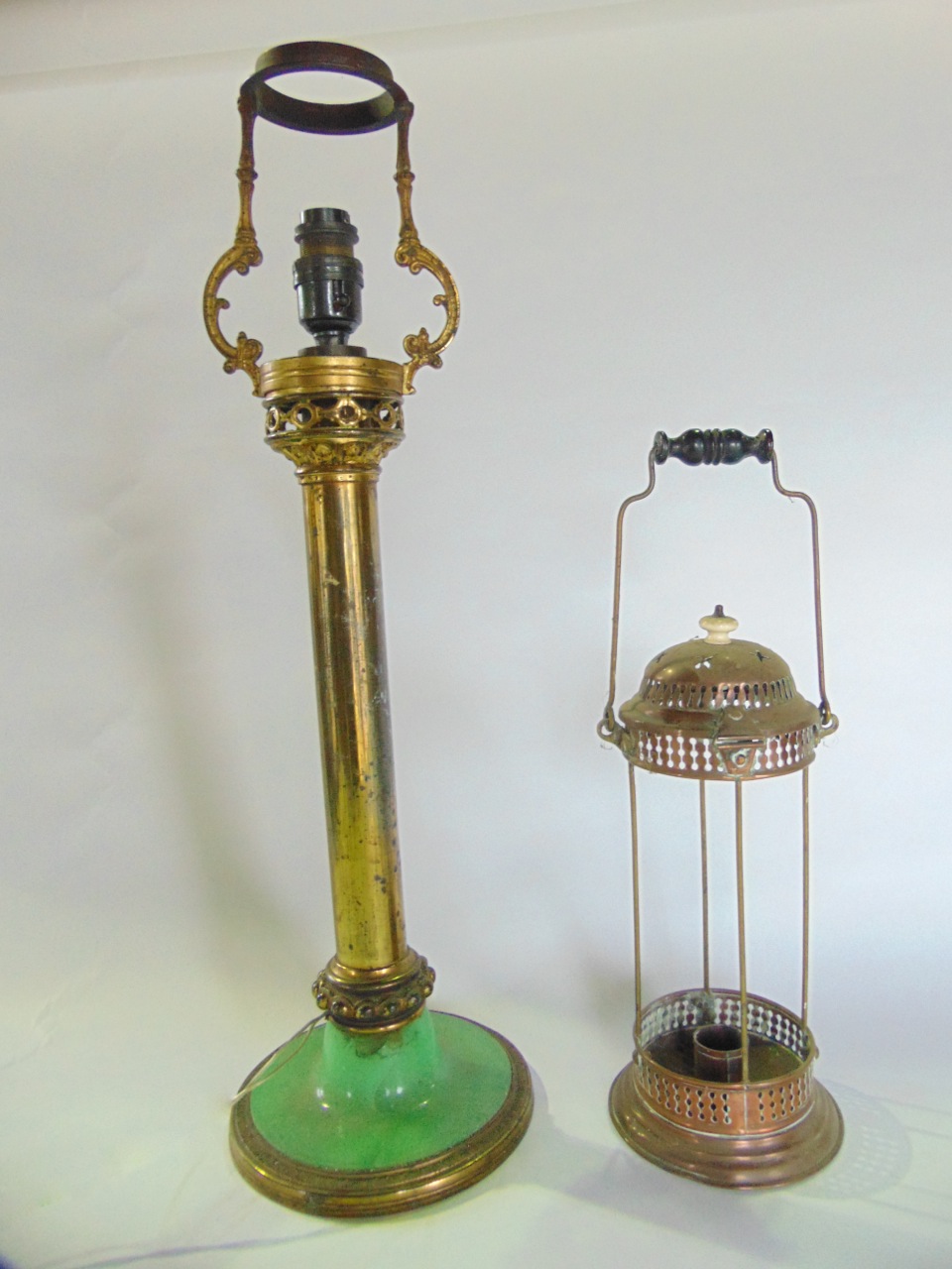 A Victorian oil lamp stand with brass column and foliated detail, later adapted to electricity