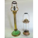 A Victorian oil lamp stand with brass column and foliated detail, later adapted to electricity