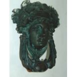 A 19th century cast brass door knocker in the form of a classical female head