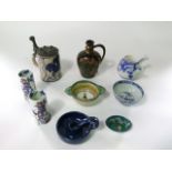 A collection of ceramics including an unusual studio pottery type flagon with copper lustred glaze