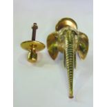 An unusual cast brass door knocker in the form of an elephants head with long trunk