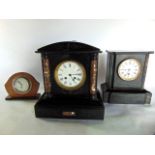Two Victorian black slate and marble mantle clocks and a further Smith's dashboard clock with