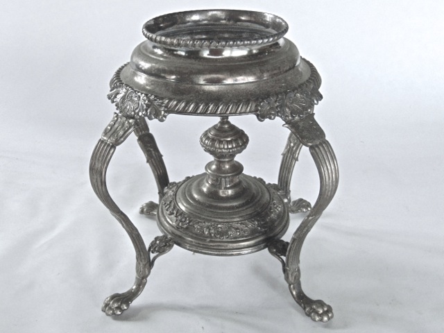 A silver plated table standing oil lamp frame on lions paw feet, further oil lamp including two wall