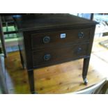 A 19th century mahogany commode, later converted to a low chest with frieze drawer raised on