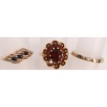 Two ladies 9ct gold dress rings, one red garnet together with a sapphire, a diamond chip ring and