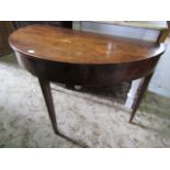 A Georgian mahogany demi-lune side table raised on square tapered supports (ex dining table