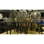 A set of five stained elm and beechwood Windsor hoop and stick back kitchen chairs with central