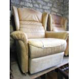 A pair of contemporary light brown suede leather upholstered wing back reclining armchairs