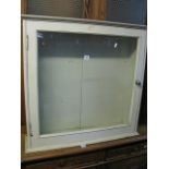 A Victorian mahogany wall mounted display case enclosed by a rectangualr glazed panelled door (later