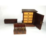 An inlaid Edwardian mahogany table cabinet, the door enclosing four frieze drawers with satinwood