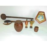 An Indian carved hardwood barrel shaped tea caddy, an African Knobkerry club and axe etc