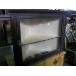 A late Victorian /Edwardian mahogany hanging corner display cabinet enclosed by a rectangular glazed