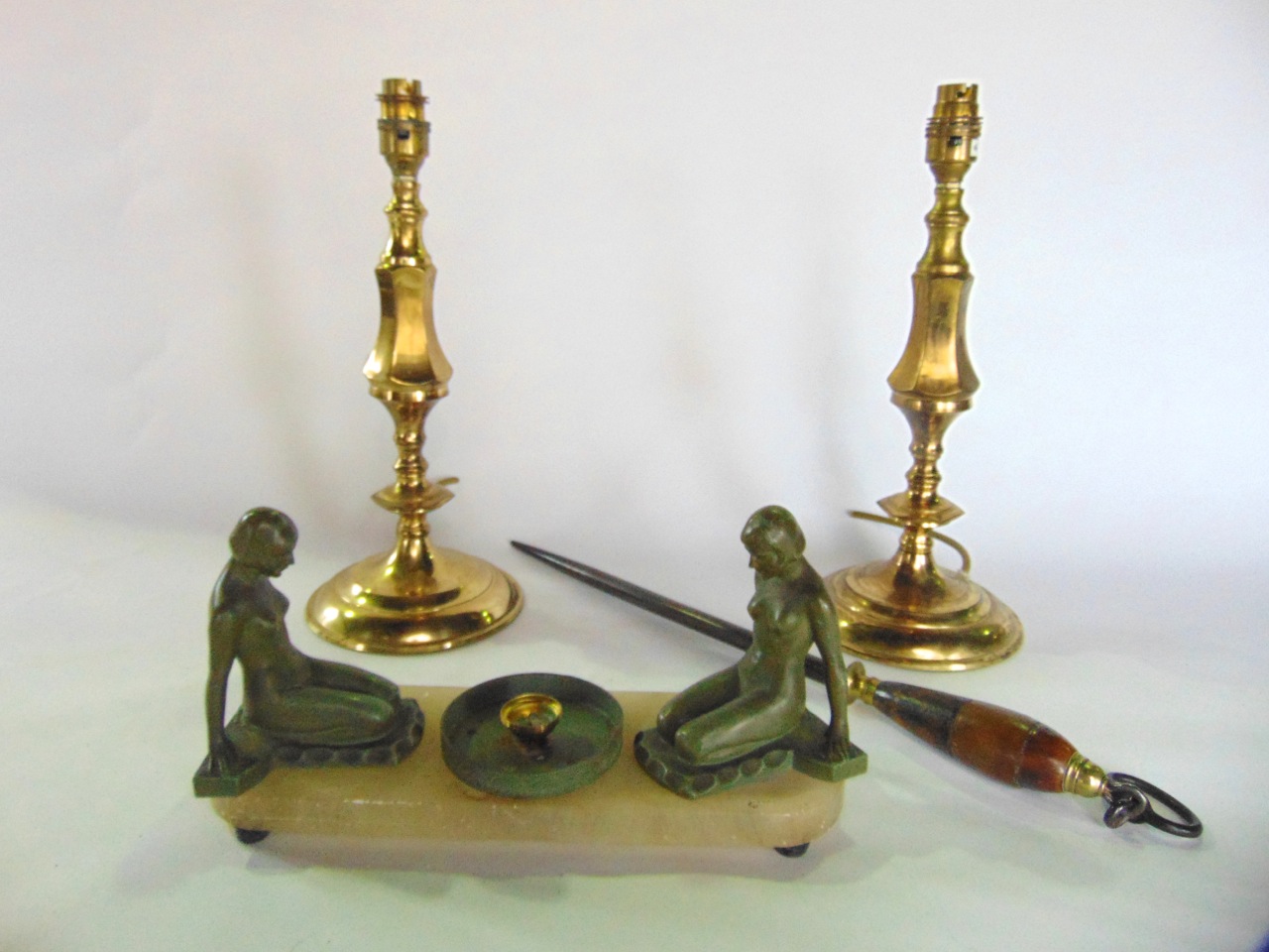 A pair of 19th century style brass lamps adapted for electricity on turned bases, a Victorian