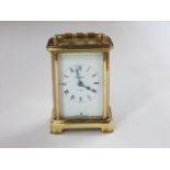A simple brass case carriage clock by Bayard with eight day time piece (working)