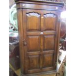 A good quality reproduction 18th century style hanging corner cupboard enclosed by six fielded