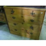 A late Victorian/Edwardian stripped pine bedroom chest of three long and two short graduated