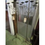A pair of floor standing ironwork five branch candle stands