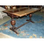 An unusual early 20th century oak drawleaf dining table of rectangular form with single additional