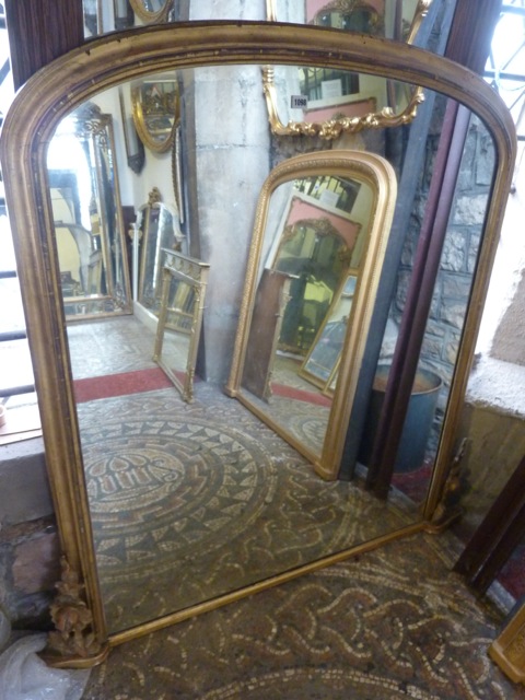 A Victorian over mantle mirror with gilt moulded arched frame, 132 cm high x 130 cm wide approx