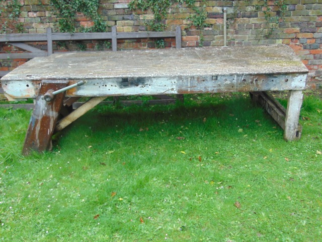 A large vintage rustic pine work bench with boarded top and two vices (one either side) approx