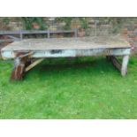 A large vintage rustic pine work bench with boarded top and two vices (one either side) approx